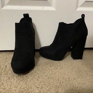 Heeled black booties